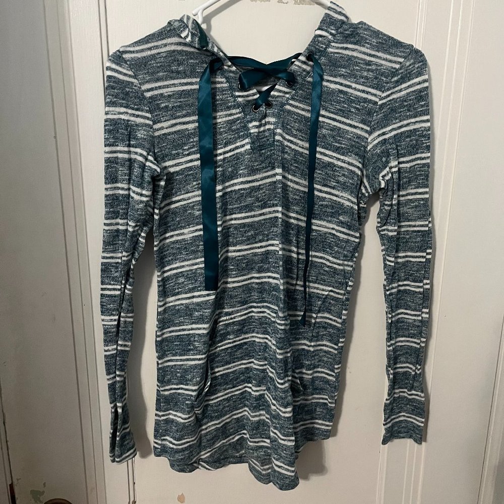 Blue-green shirt with hood.